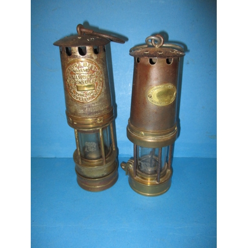 124 - A 1920s Patterson type miners lamp and an Ackroyd & Beld ltd example, both in used condition and gen... 