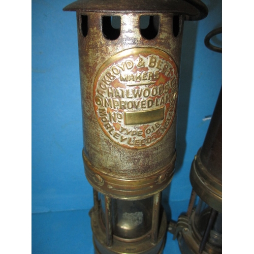 124 - A 1920s Patterson type miners lamp and an Ackroyd & Beld ltd example, both in used condition and gen... 