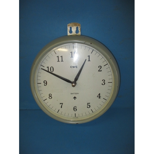 126 - A British naval issue wardroom/bulkhead timepiece, having 9” white dial, marked CWC with war dept cr... 