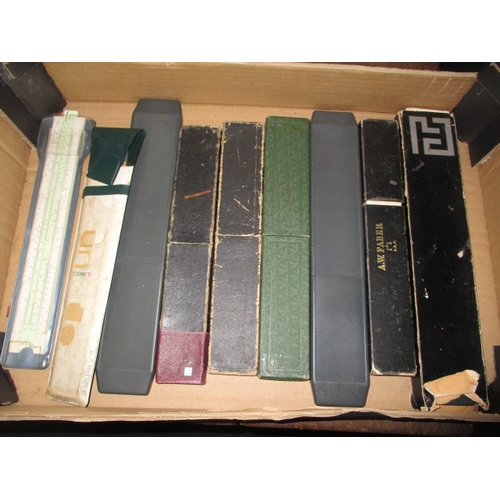 129 - A large collection of vintage slide rules, and a ‘Magic Brain Calculator, all in pre-owned condition