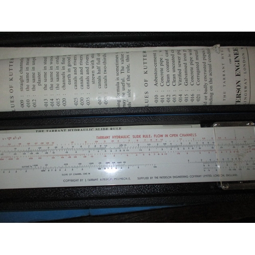 129 - A large collection of vintage slide rules, and a ‘Magic Brain Calculator, all in pre-owned condition