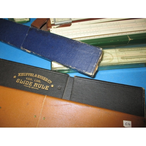 129 - A large collection of vintage slide rules, and a ‘Magic Brain Calculator, all in pre-owned condition