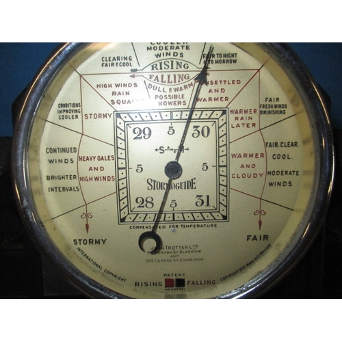 131 - A 1930s Art Deco Bakelite cased storm guide barometer, marked for John Trotter Ltd Glasgow, in used ... 