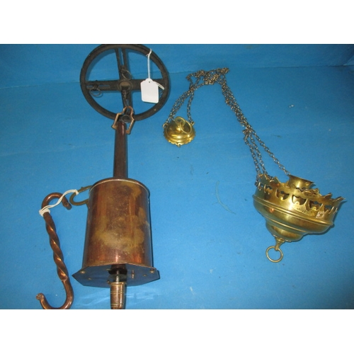 132 - An antique copper clockwork roasting jack and a late Victorian hanging brass candlestick signed C Fa... 