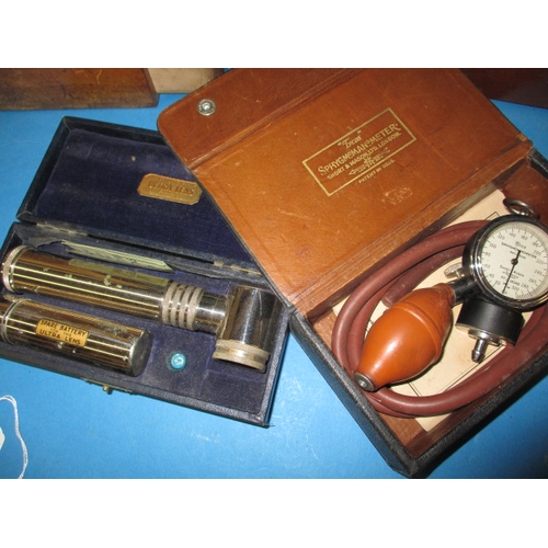 136 - A parcel of vintage medical and other instruments, to include an electric shock machine, all in used... 