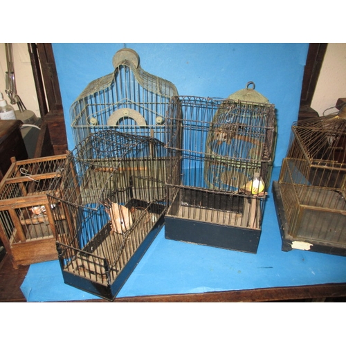 143 - A collection of vintage songbird cages, all in used condition