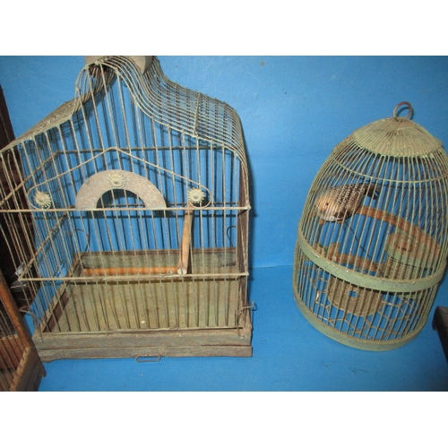 143 - A collection of vintage songbird cages, all in used condition