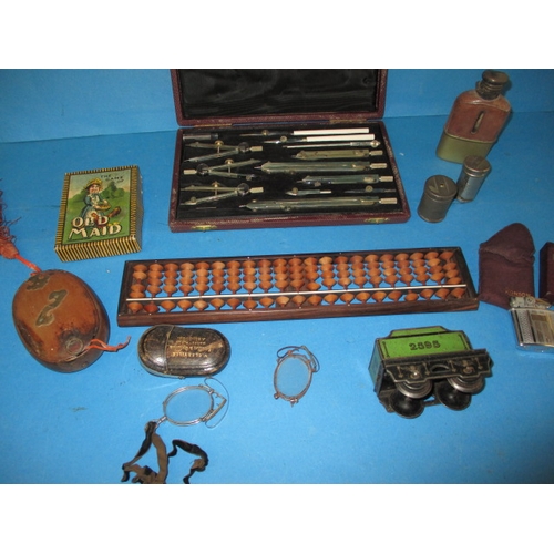 146 - A parcel of interesting collectables, to include a technical drawing set and coin tubes, all in used... 