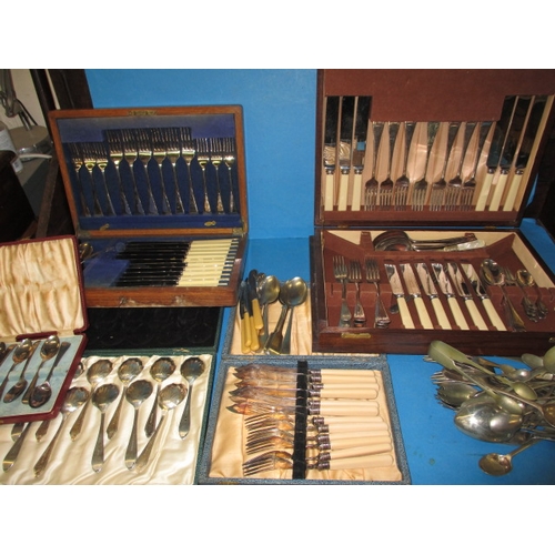 150 - A large quantity of vintage cutlery and flatware, some in boxes, all in used condition