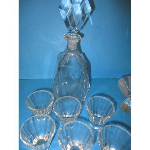 152 - Two vintage lead crystal decanters with matching glasses and another example, in pre-owned condition... 