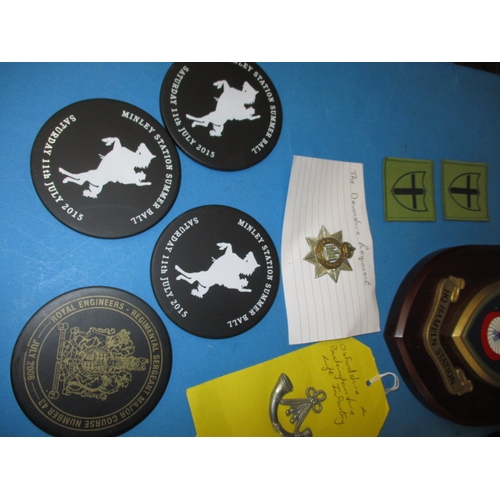 163 - A parcel of vintage military related items, to include regimental shields and badges, various ages, ... 