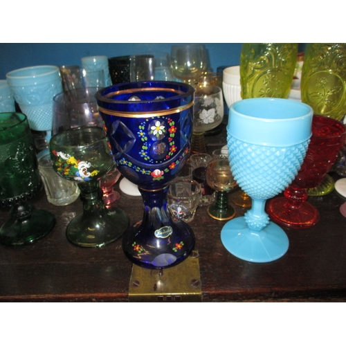 173 - A large quantity of antique and later glass drinking vessels, to include Sowerby and Uranium glass e... 