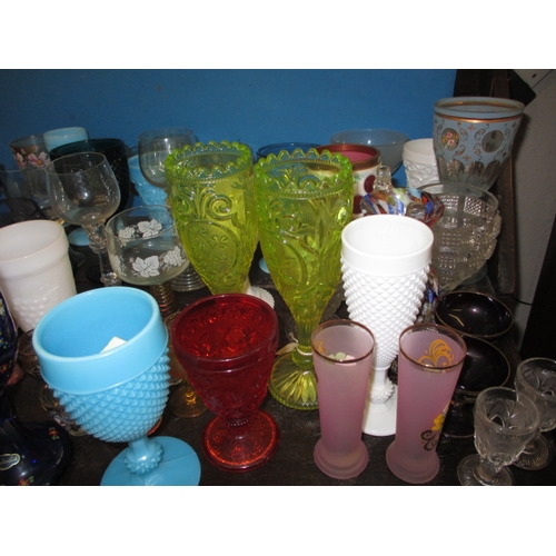 173 - A large quantity of antique and later glass drinking vessels, to include Sowerby and Uranium glass e... 