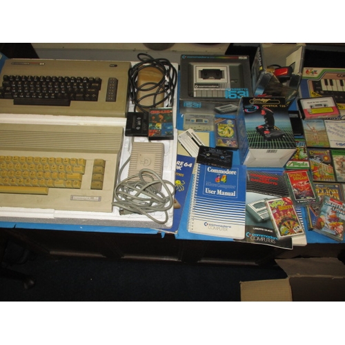 178 - Two boxed 1980s Commodore home computer systems, with numerous games and accessories, believed to be... 