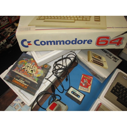 178 - Two boxed 1980s Commodore home computer systems, with numerous games and accessories, believed to be... 