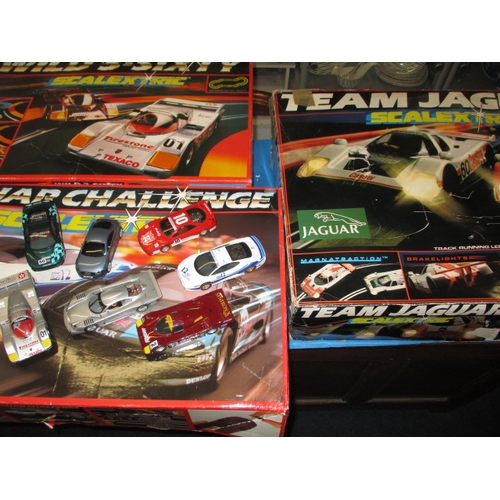 179 - 3 boxed sets of Scalextric motor racing games, and accessories, all in used condition