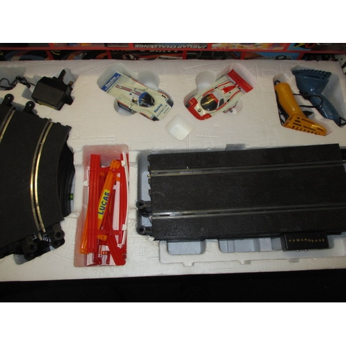 179 - 3 boxed sets of Scalextric motor racing games, and accessories, all in used condition