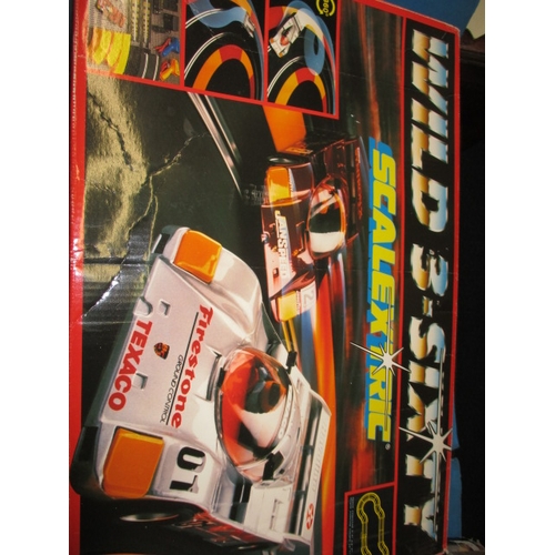 179 - 3 boxed sets of Scalextric motor racing games, and accessories, all in used condition