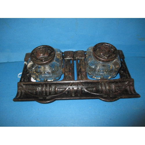 186 - A vintage two bottle cast iron inkwell, in the Rennie Mackintosh style, approx. width 25cm, in useab... 