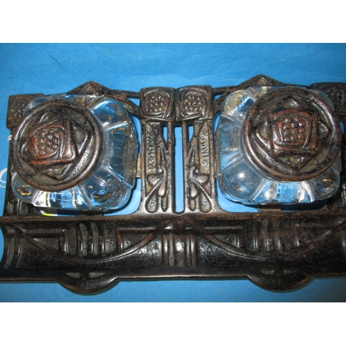 186 - A vintage two bottle cast iron inkwell, in the Rennie Mackintosh style, approx. width 25cm, in useab... 