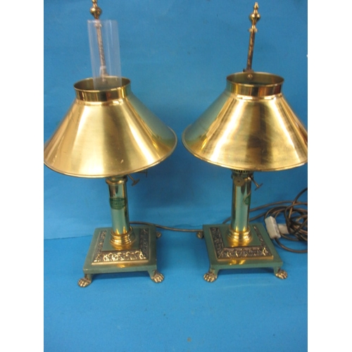 187 - A pair of decorative table lamps, in the style of oil lights, with adjustable height shades, both in... 