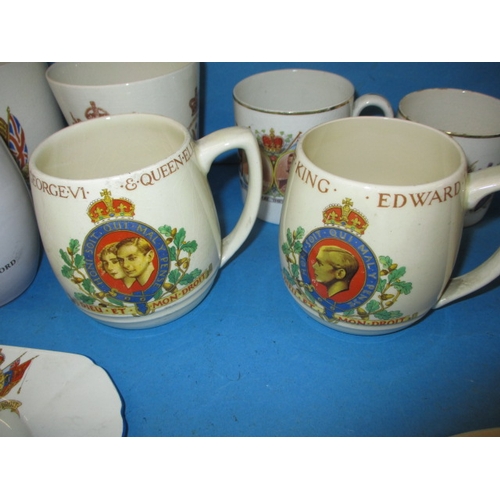 189 - A quantity of commemorative items, to include a mug designed by Richard Guyatt for Wedgwood, all in ... 