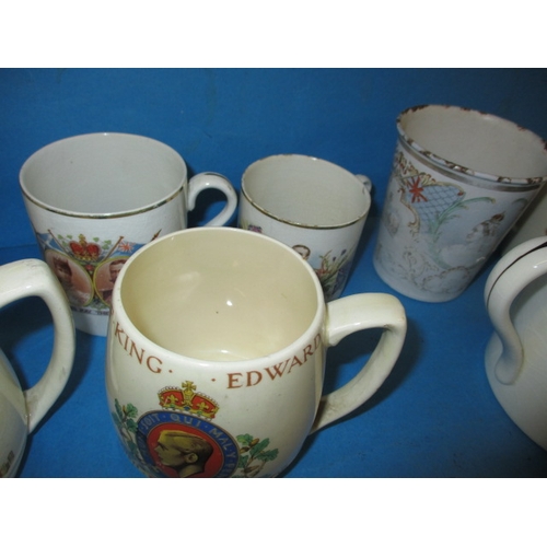 189 - A quantity of commemorative items, to include a mug designed by Richard Guyatt for Wedgwood, all in ... 