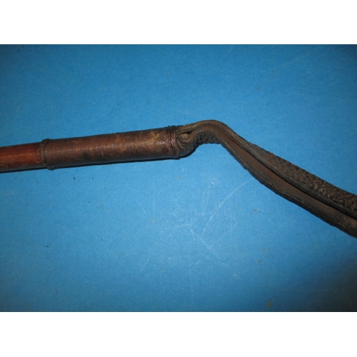 214 - A vintage riding crop by Swaine and Adeney Ltd and some vintage horse brasses