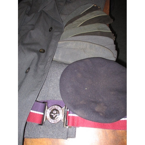 217 - A post war RAF observer corps tunic with airman’s rainproof coat and caps, all in used condition, wi... 