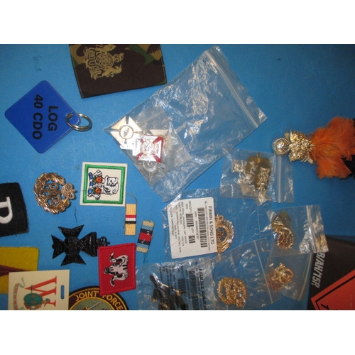 238 - A quantity of military stay-bright badges and other military insignia, all in pre-owned condition