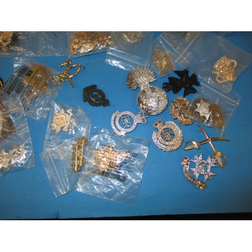 238 - A quantity of military stay-bright badges and other military insignia, all in pre-owned condition