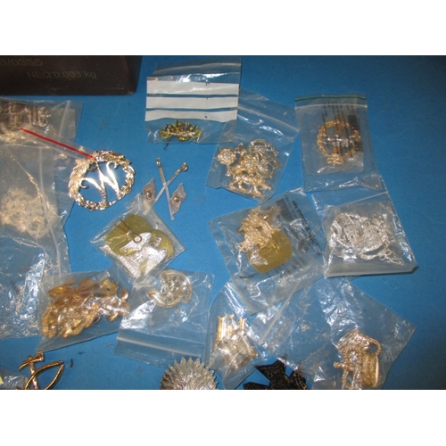 238 - A quantity of military stay-bright badges and other military insignia, all in pre-owned condition