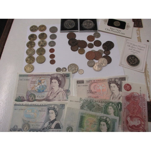 243 - A parcel of coins and banknotes, to include several £2 coins, all in circulated condition