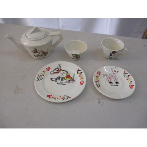 254 - A vintage English made child’s part tea set, depicting characters from ‘Muffin the Mule’. 2 pieces w... 