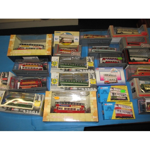 262 - A quantity of die-cast model busses and trams, most boxed and unused