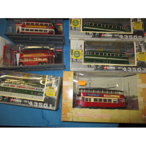 262 - A quantity of die-cast model busses and trams, most boxed and unused