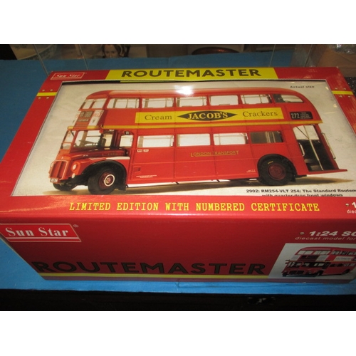 263 - Two large 1/24 scale model busses, boxed and unused and each with a Perspex display case, the Routem... 