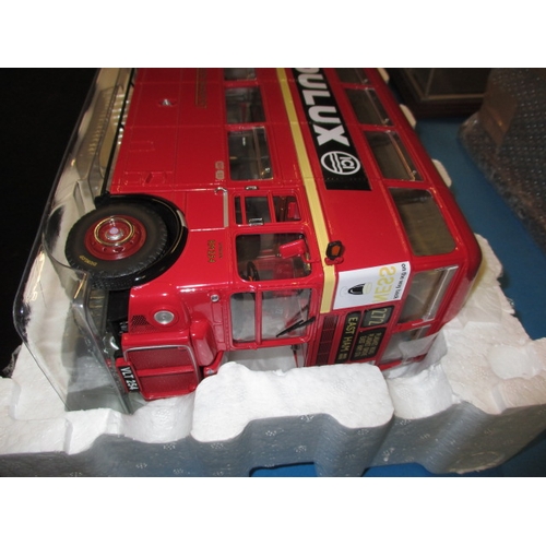 263 - Two large 1/24 scale model busses, boxed and unused and each with a Perspex display case, the Routem... 