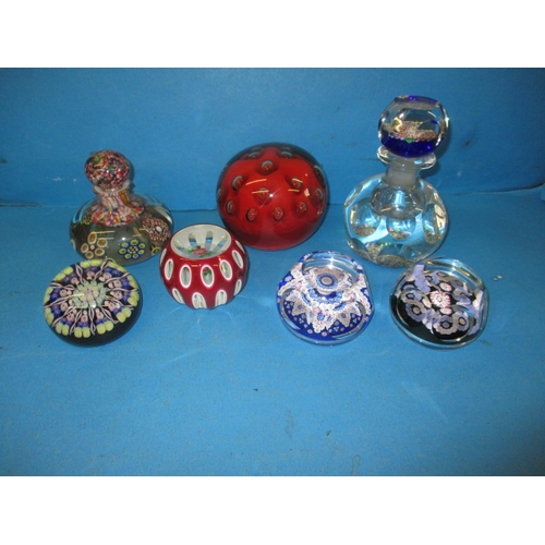 273 - A parcel of glass paperweights and decanters, most millefiori pattern, to include Perthshire, the sm... 