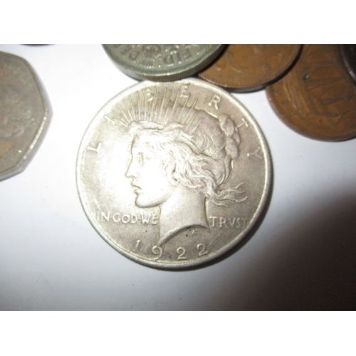 275 - A parcel of vintage coins, to include a 1922 American silver Dollar, all in circulated condition