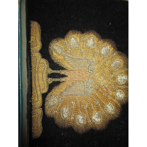 284 - An Art deco evening clutch bag, with a peacock design in gold and silver thread, and another vintage... 