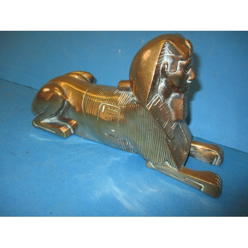 291 - A 1930s cast bronze sphinx door stop, approx. length 24cm in good useable pre-owned condition