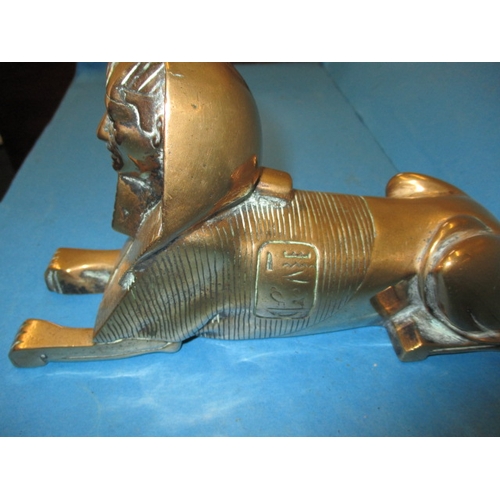 291 - A 1930s cast bronze sphinx door stop, approx. length 24cm in good useable pre-owned condition