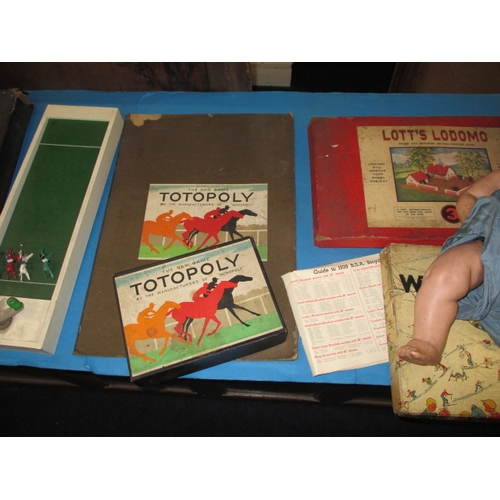 295 - A quantity of vintage children’s games and an AM Doll, all in used condition