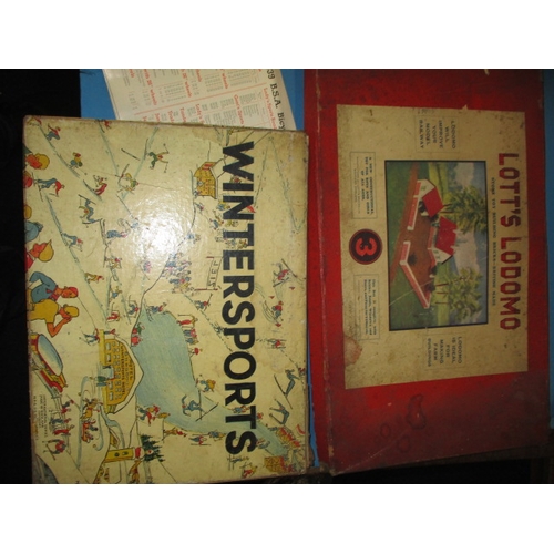 295 - A quantity of vintage children’s games and an AM Doll, all in used condition