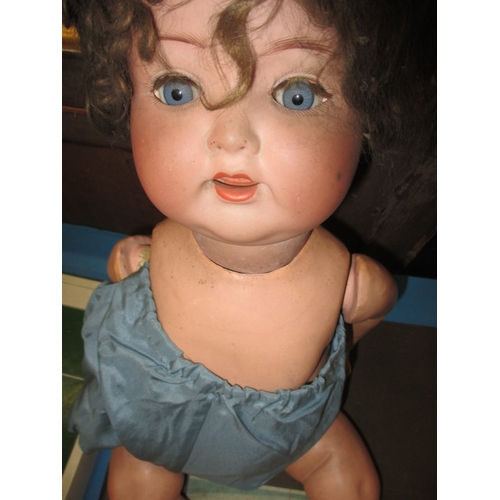 295 - A quantity of vintage children’s games and an AM Doll, all in used condition