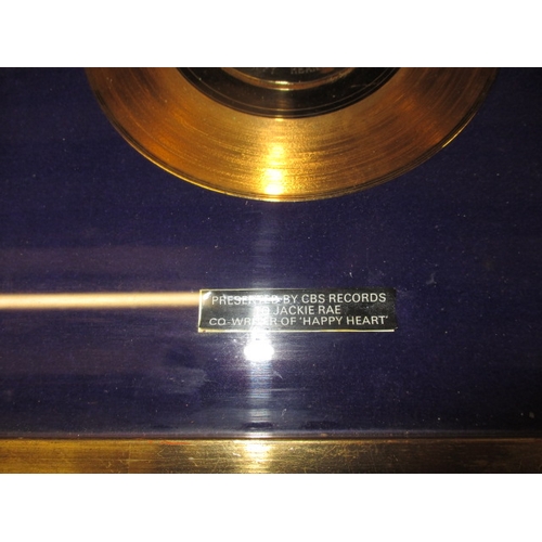 298 - A parcel of Jackie Rae memorabilia to include a presentation gold disk by Andy Williams and other pr... 