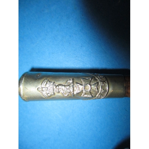 303 - A vintage military swagger stick, the nickel silver cap reads Toaey Nikato, approx. length 66cm in u... 