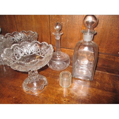 310 - A parcel of glass decanters and other items, one decanter with chip to rim, no other observed damage