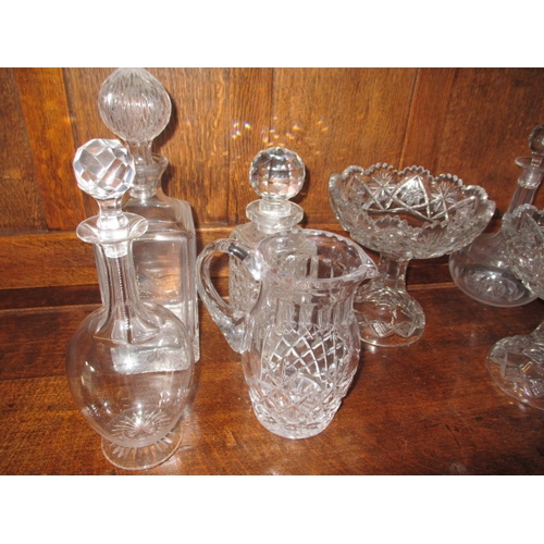 310 - A parcel of glass decanters and other items, one decanter with chip to rim, no other observed damage